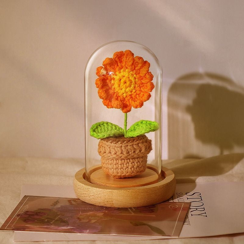 knitted potted plant with glass cover