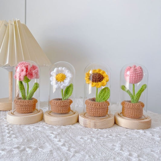 knitted potted plant with glass cover