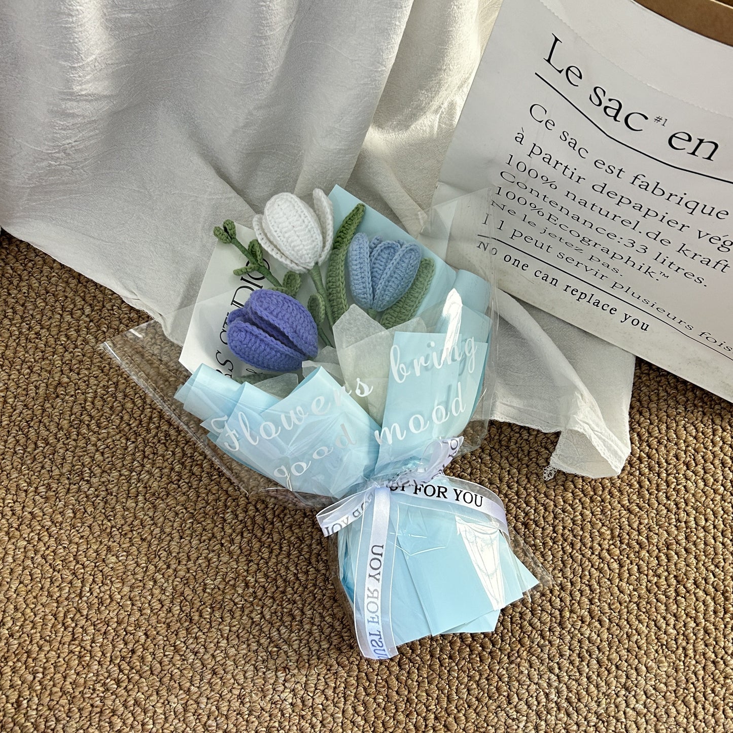 Handwoven small bouquet of blooming tulips