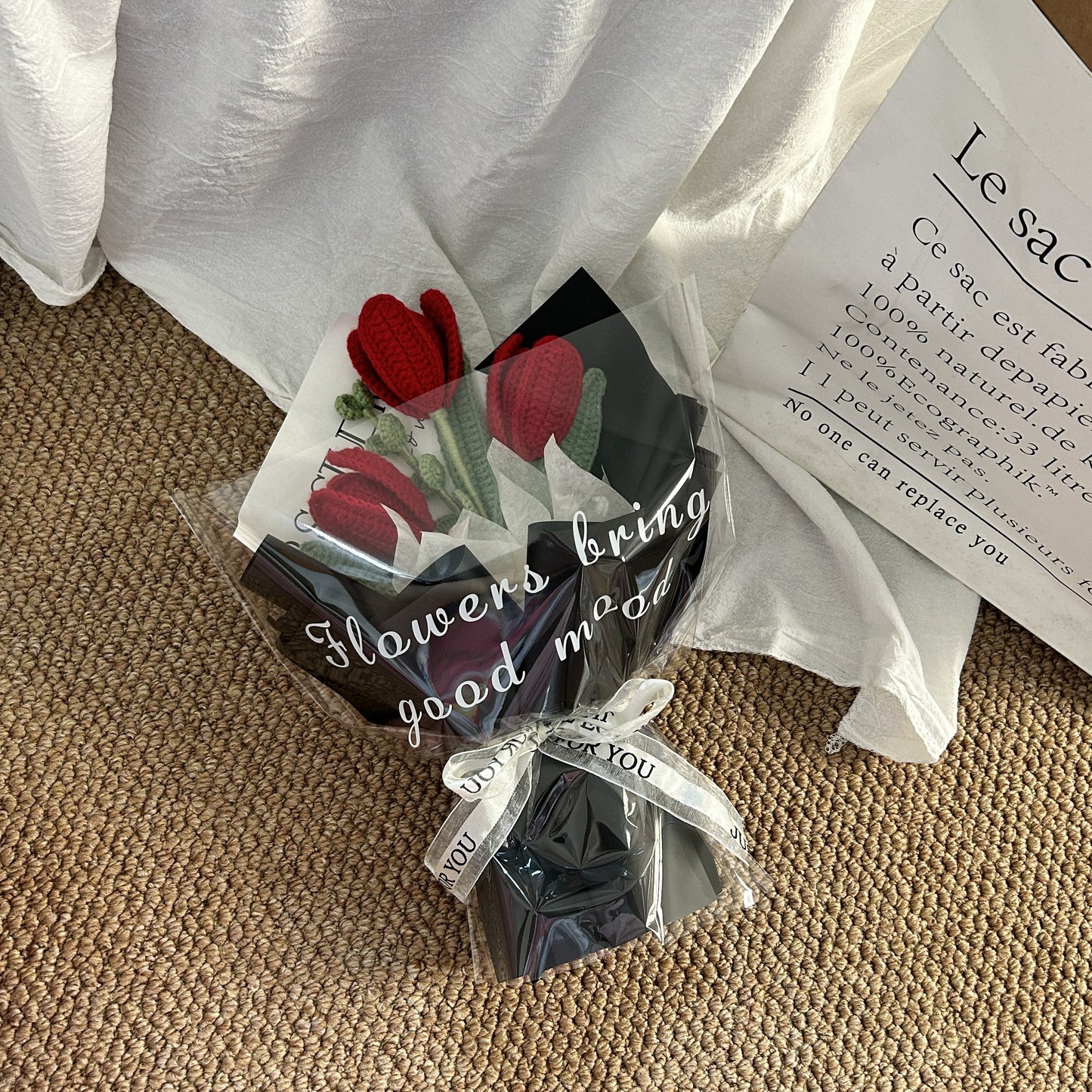 Handwoven small bouquet of blooming tulips