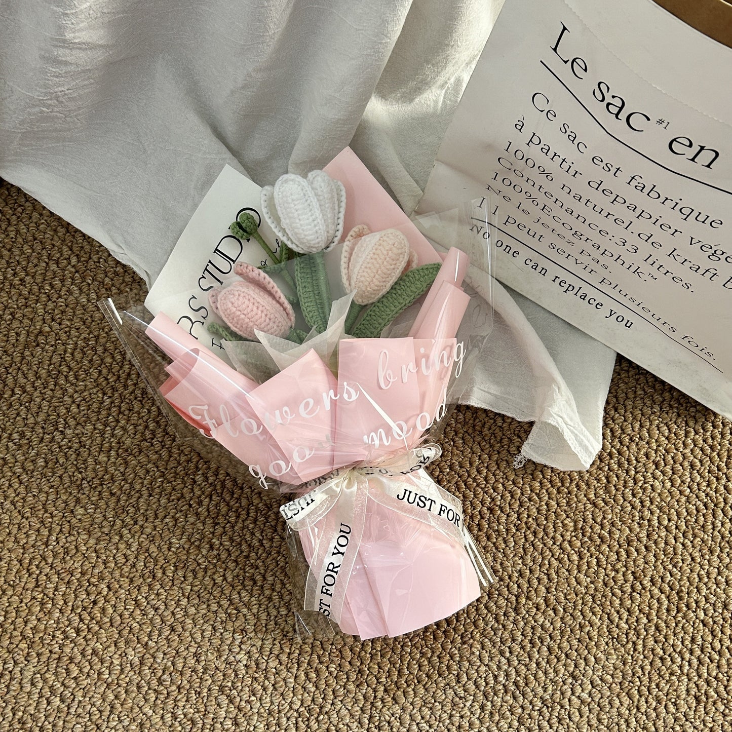 Handwoven small bouquet of blooming tulips