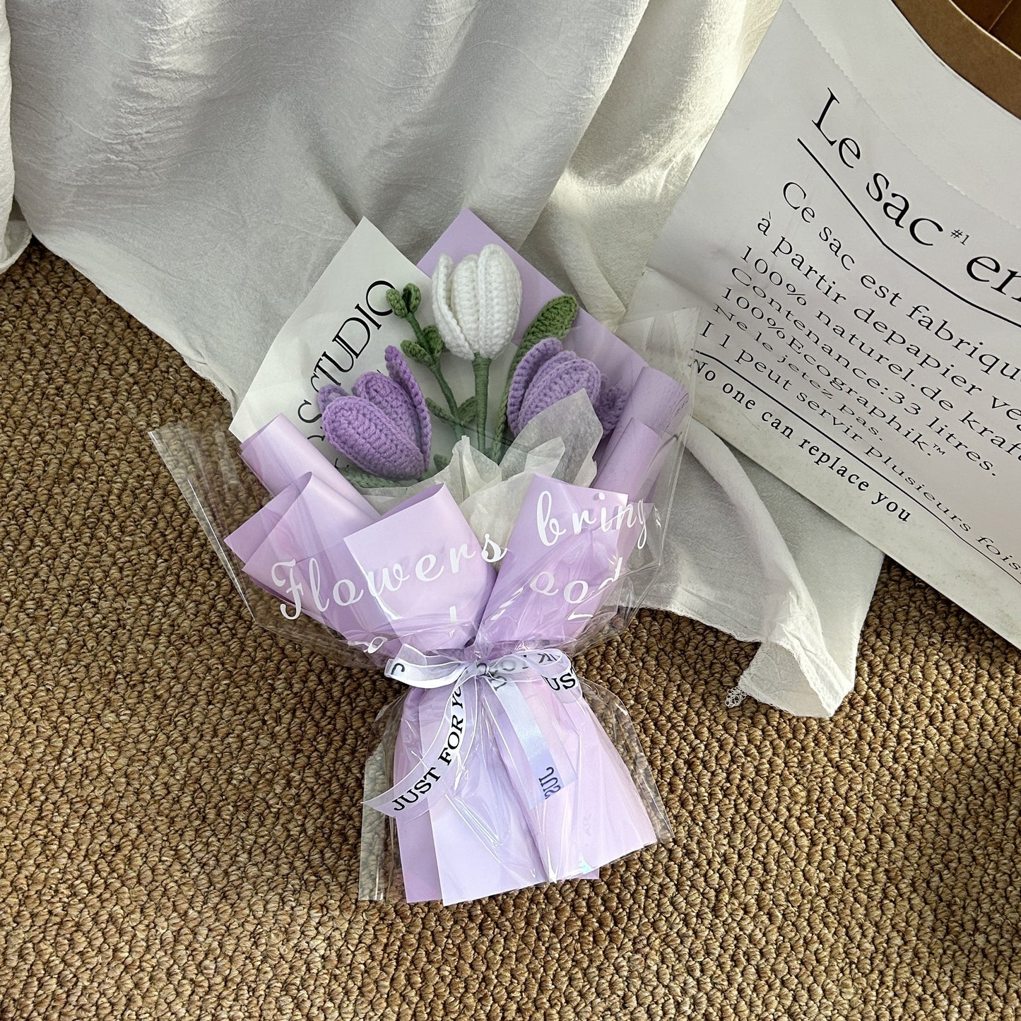 Handwoven small bouquet of blooming tulips