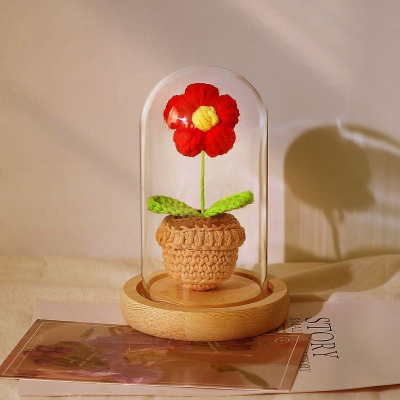 knitted potted plant with glass cover