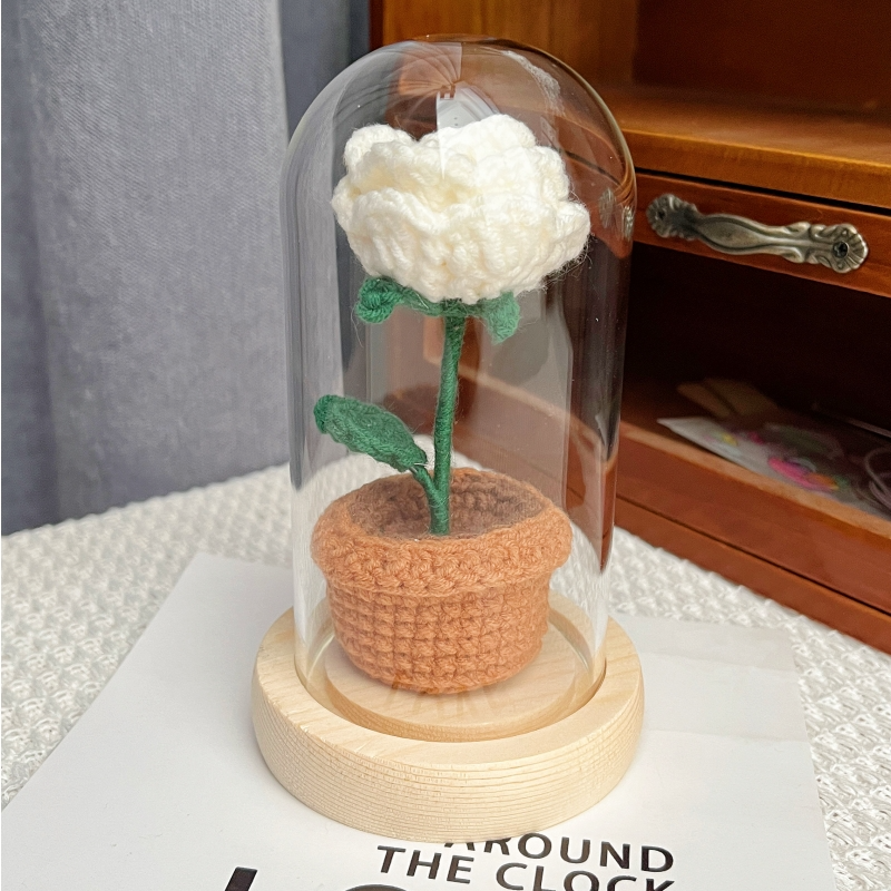 knitted potted plant with glass cover