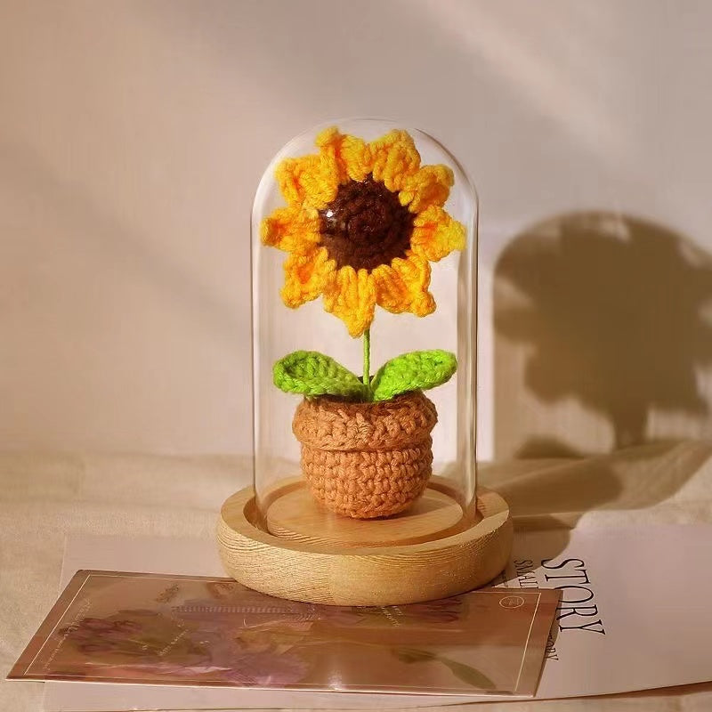 knitted potted plant with glass cover