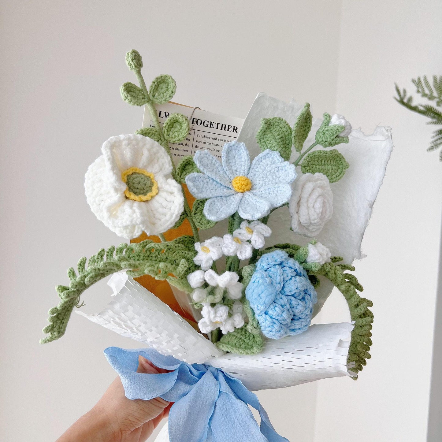 Handmade crocheted blue and white flower bouquet