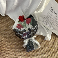 Handwoven small bouquet of blooming tulips