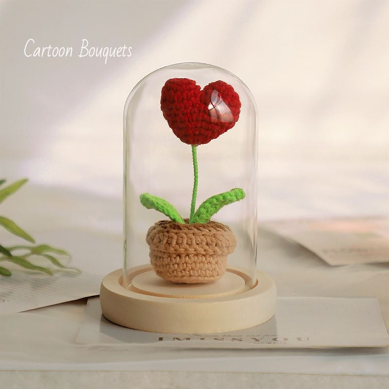 knitted potted plant with glass cover